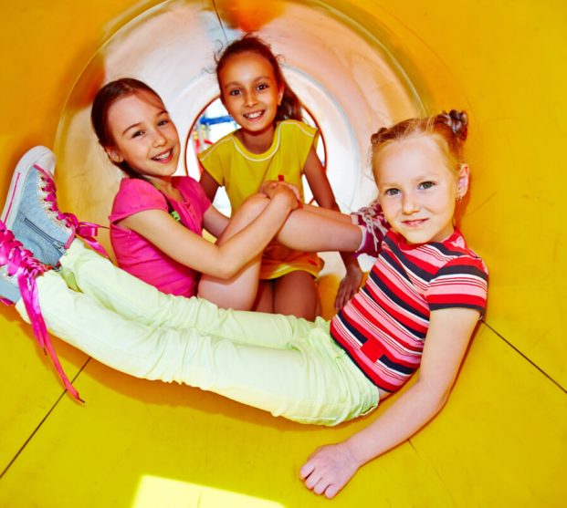 little-girls-playing-slide-playground