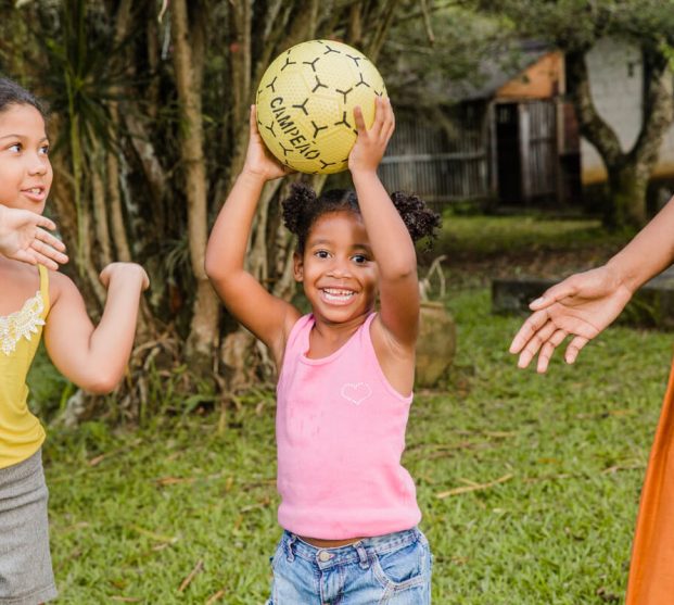 two-little-girls-playing-with-ball